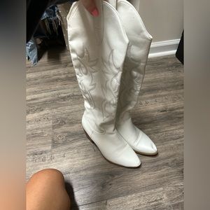 Tall white cowboy boots